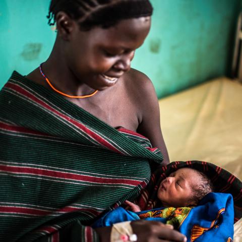 New mother holds baby