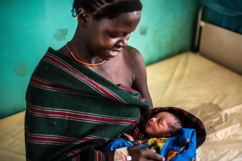 New mother holds baby