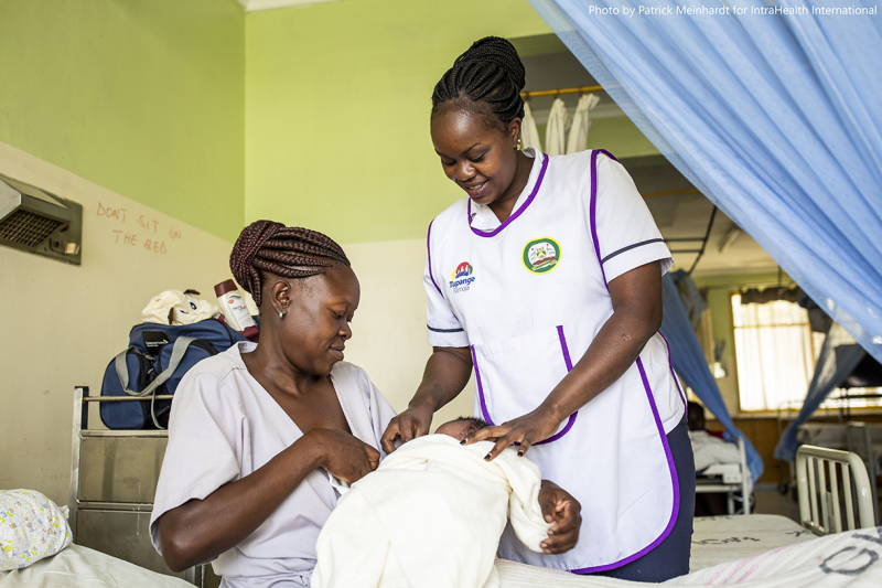 Nurse Florence Joel helps a new mother and her baby.