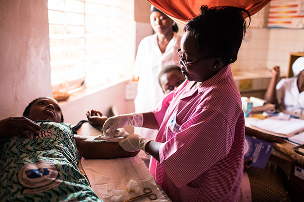 A client receives a contraceptive implant 