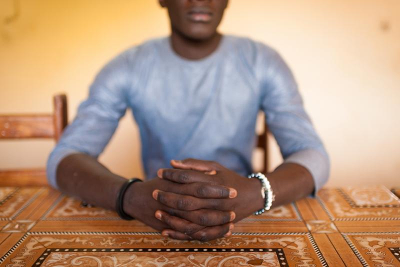 Oumar, an HIV peer mediator.