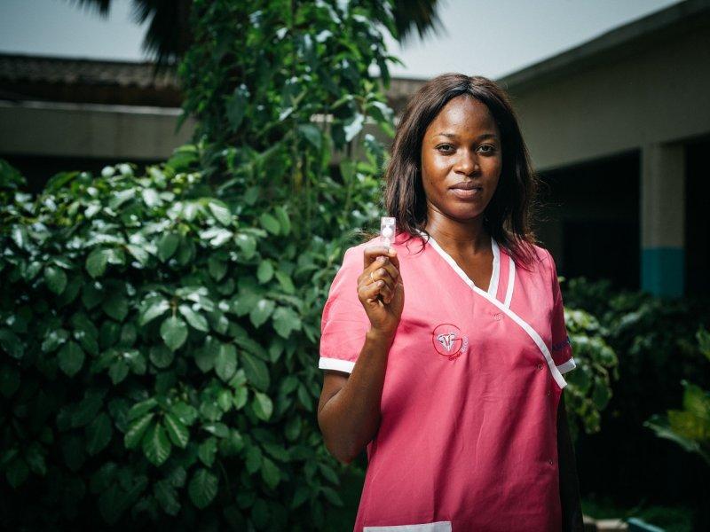 health worker in Senegal holds Sayana Press