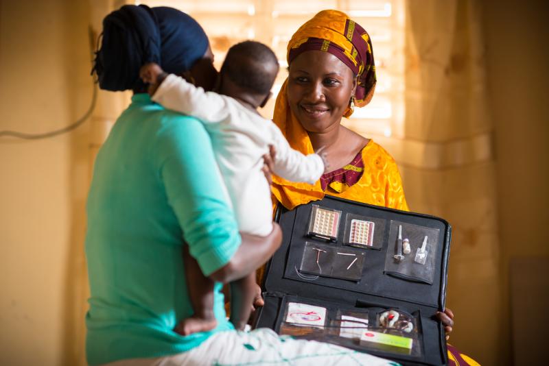 health worker counseling a client on contraceptives