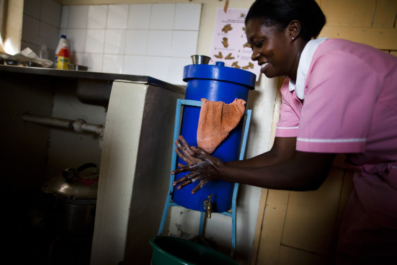 Health worker washing hands