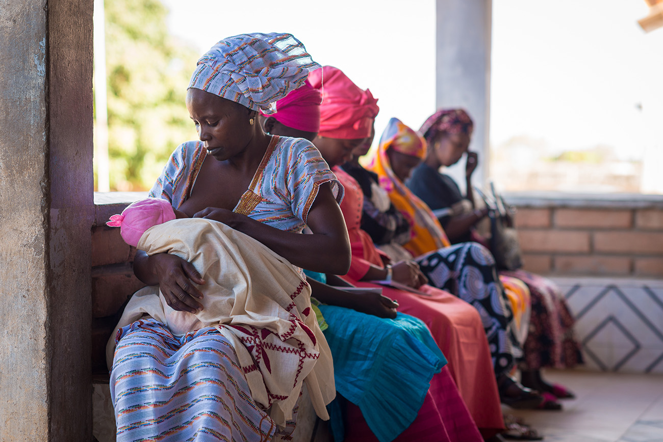 Clients waiting at the Tanaff Health Center in Senegal in 2019. Photo by Clement Tardif for IntraHealth International.