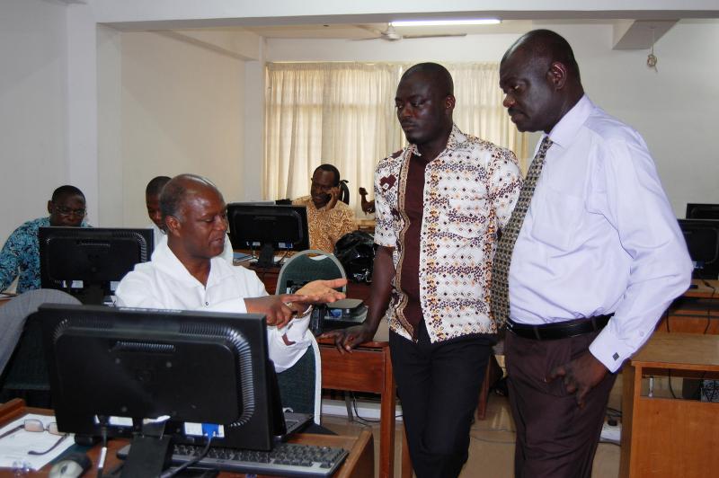 Dr. Ebenezer Appiah-Denkyira (left), director general of the Ghana Health Service, participates in an iHRIS training in March 2014 where he urged all regional directors and managers to adopt and roll-out the software. 'Whatever information that we want concerning personnel management and development, you can get from the iHRIS,' he said. Photo by Gracey Vaughn.