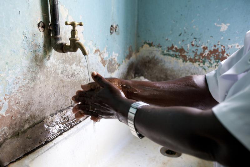 Many of these infections are spread by the hands of health workers.
A health worker at Friends Hospital in Kenya cleans her hands.