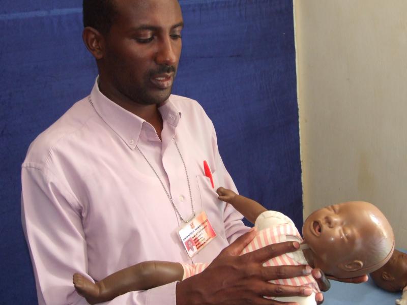 Bernard Nderitu demonstrates child resuscitation at the Kenya Medical Training College.