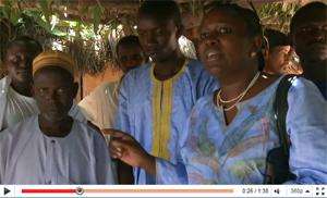 Rodio Diallo (on the right) visits a health hut.  Source: http://www.youtube.com/embed/2W2odqpieVY