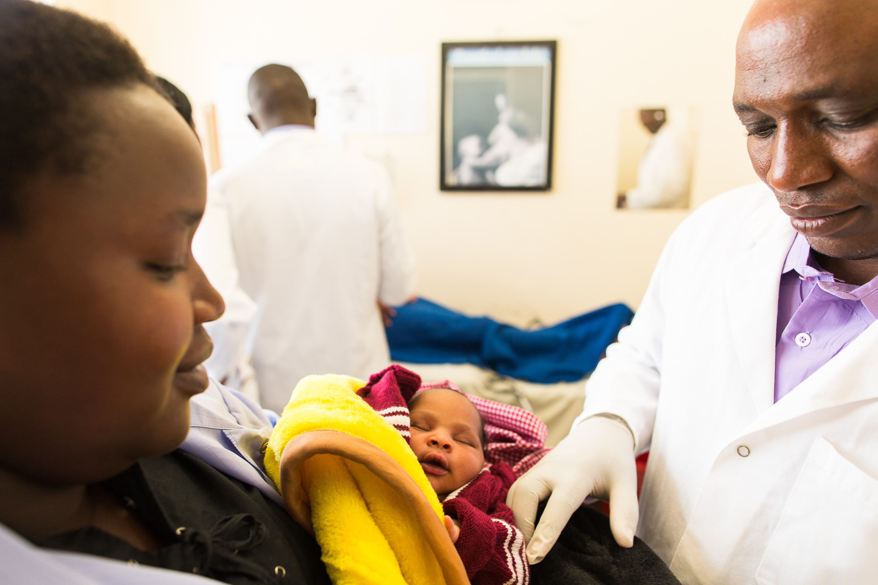 •	A staff doctor and client at Tenewek Mission Hospital, a center of excellence in Kenya 