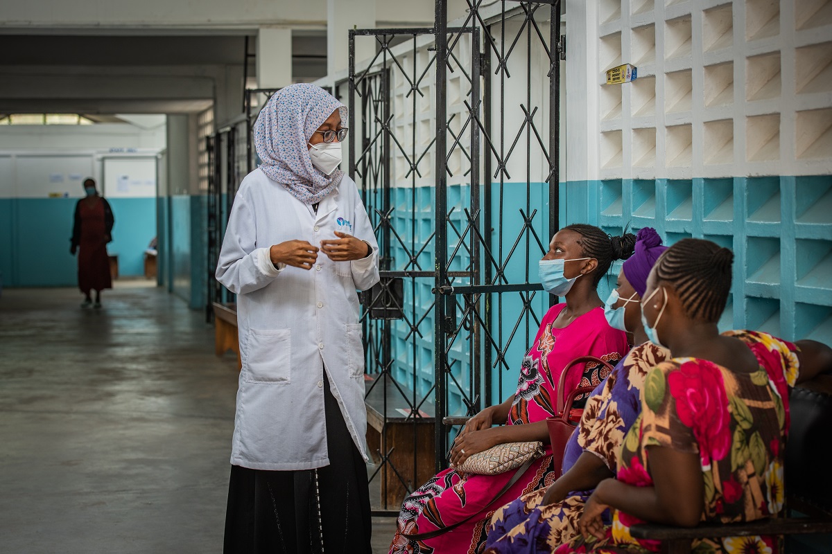 A public health officer counsels clients at Tudor Subcounty Hospital in Kenya. Photo by Edwin Joe for IntraHealth International.